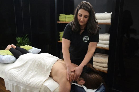 Dr Sofie of Moreland Osteopathy Coburg performing back treatment.